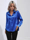 Elegante blusa de satén de manga larga: informal y lujosa.
