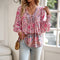 Blusa boho de mujer con mangas largas y escote con cordones y tejido ligero.