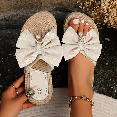 KERIN | Sandalias de esparto con lazo oversize y detalle de perla