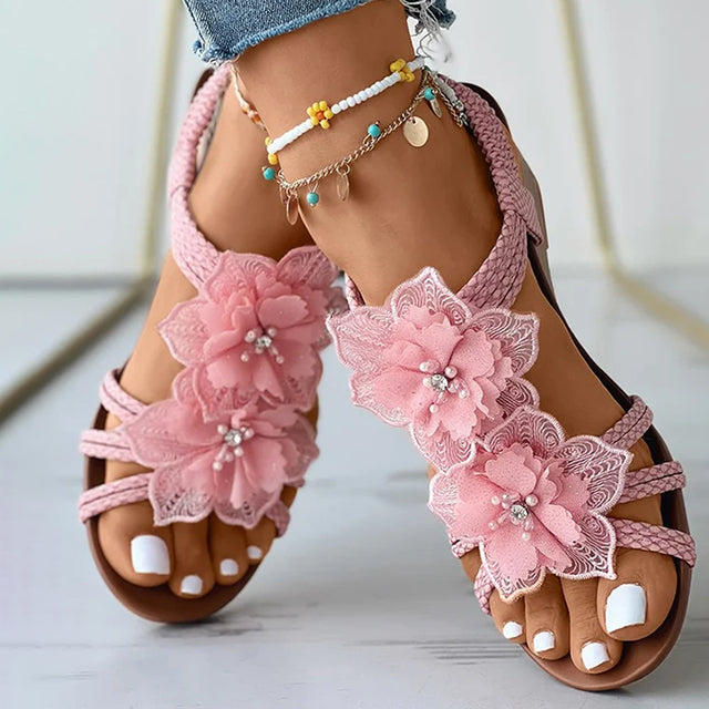 Levoire con tacco a zeppa e decorazione floreale