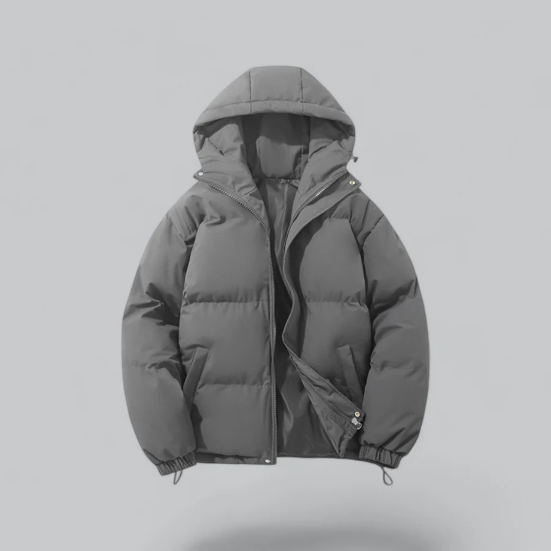 Chaqueta corta unisex con capucha y cierre de cremallera.