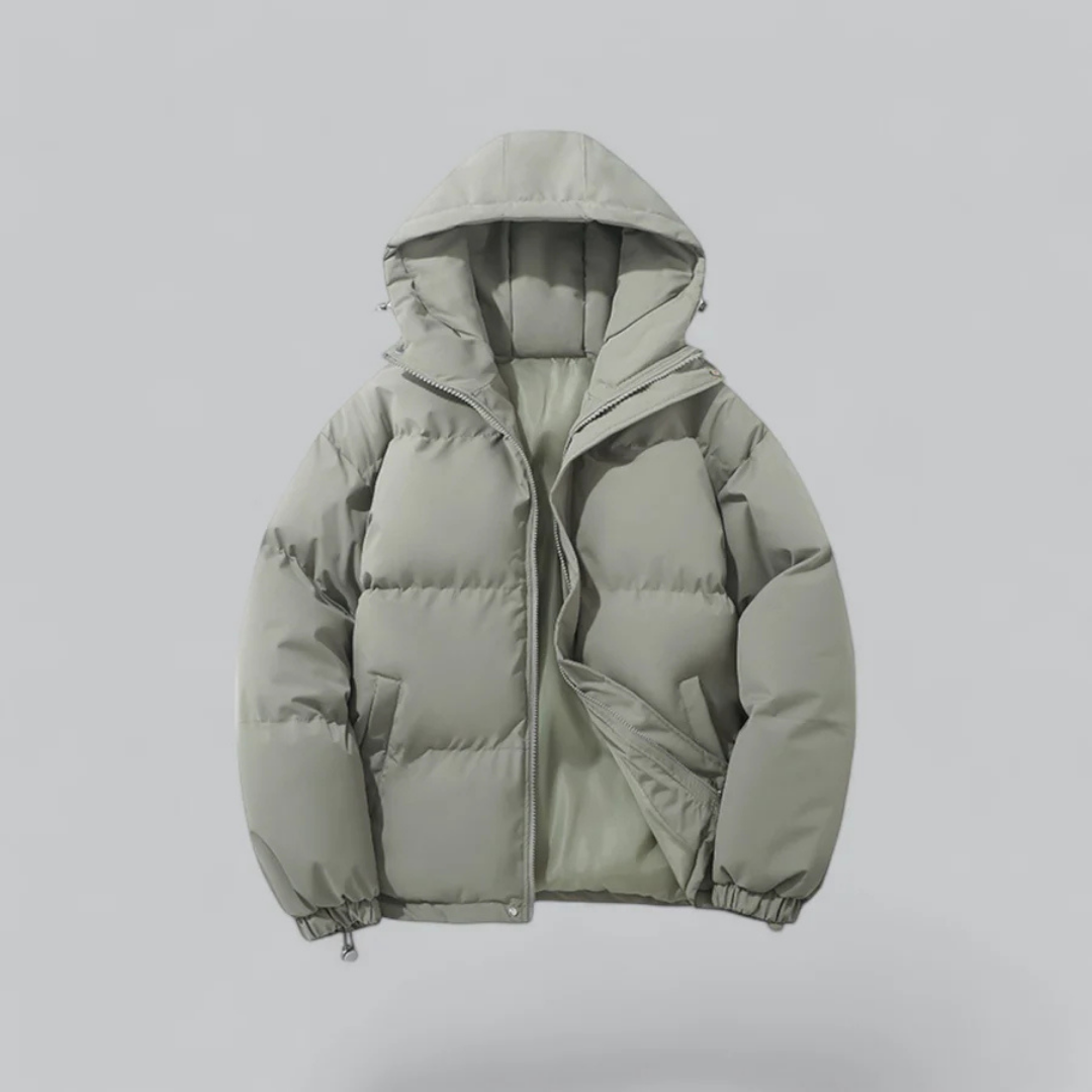 Chaqueta corta unisex con capucha y cierre de cremallera.