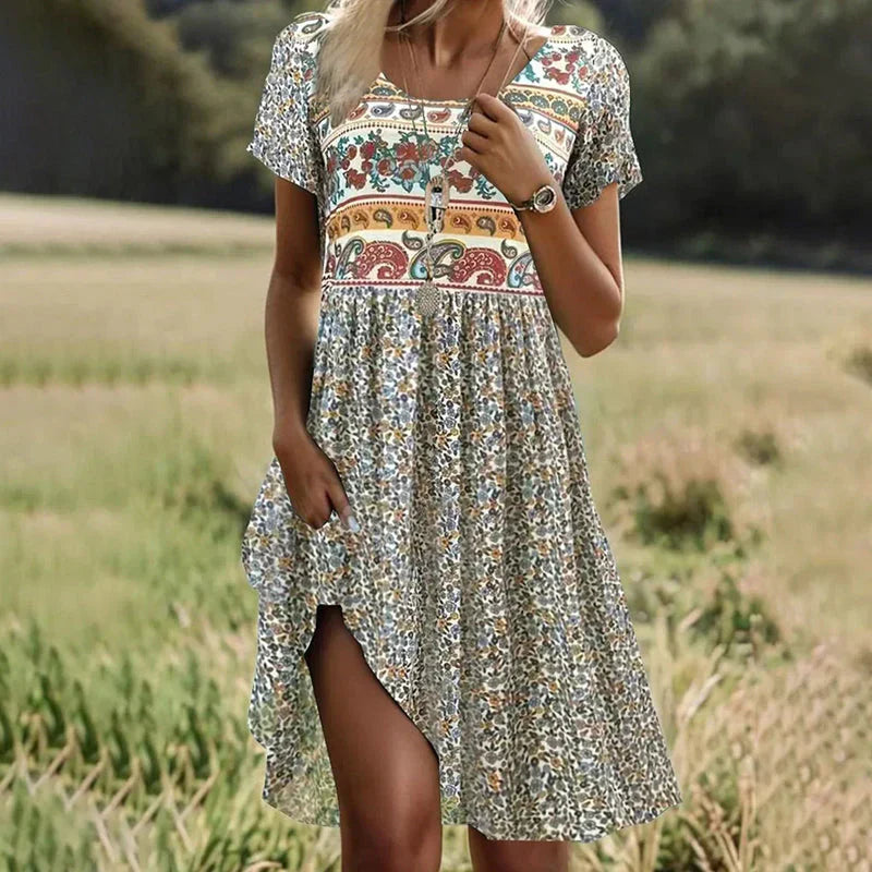 Lise | Robe midi à pois et manches courtes avec col ras du cou