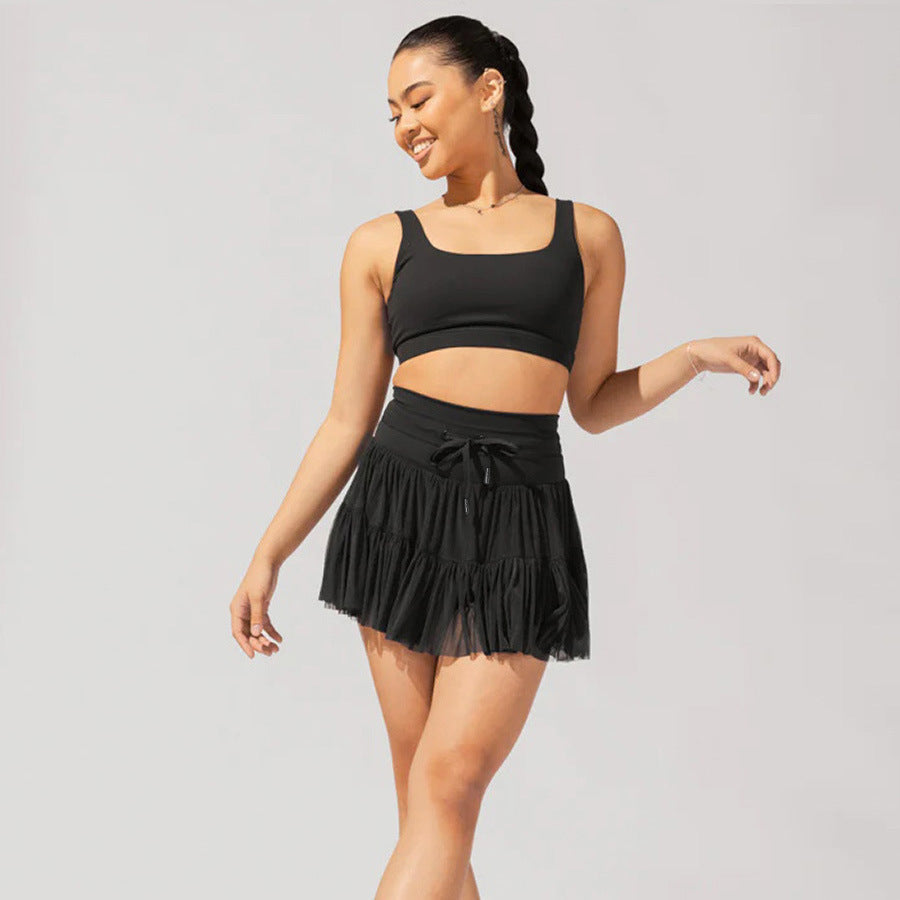 Mini-jupe taille haute pour femme avec plis et short intégré