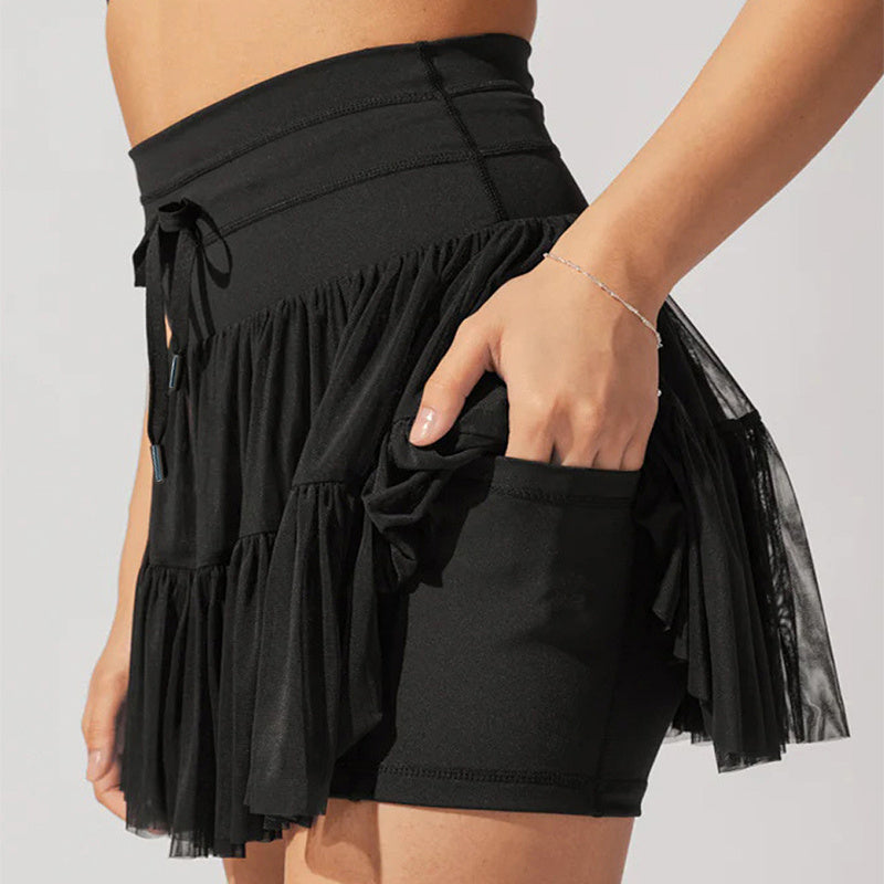 Mini-jupe taille haute pour femme avec plis et short intégré