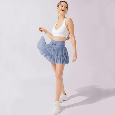 Mini-jupe taille haute pour femme avec plis et short intégré