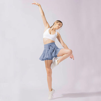 Mini-jupe taille haute pour femme avec plis et short intégré