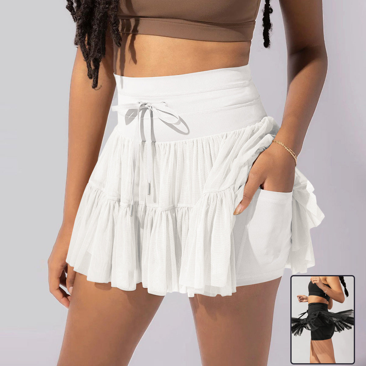 Mini-jupe taille haute pour femme avec plis et short intégré