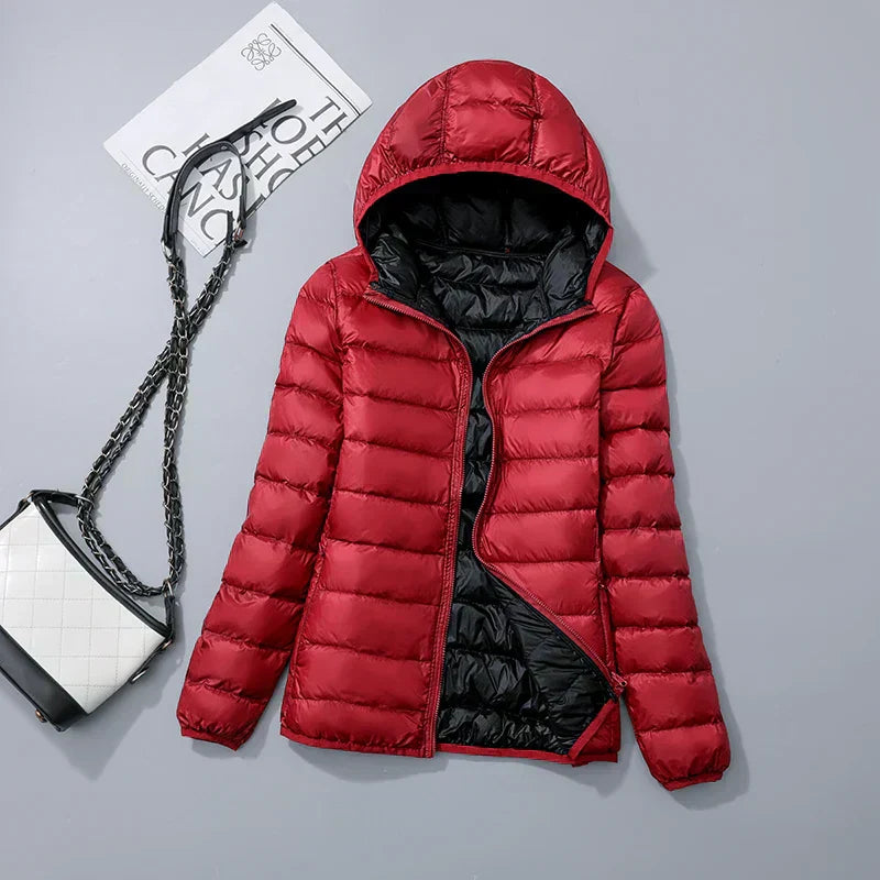 Veste à la baisse des femmes avec capuche