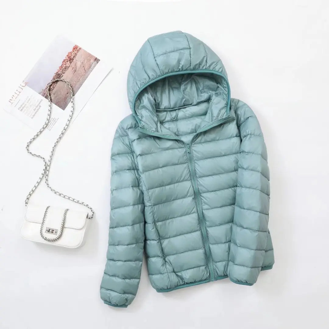 Veste à la baisse des femmes avec capuche