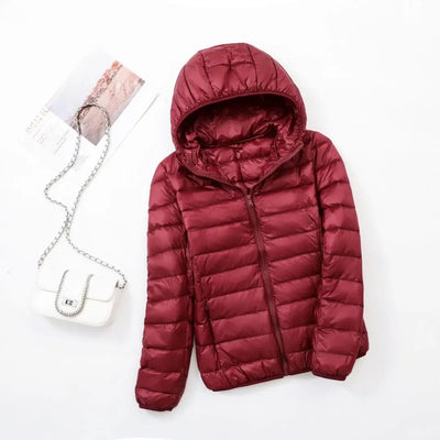 Veste à la baisse des femmes avec capuche