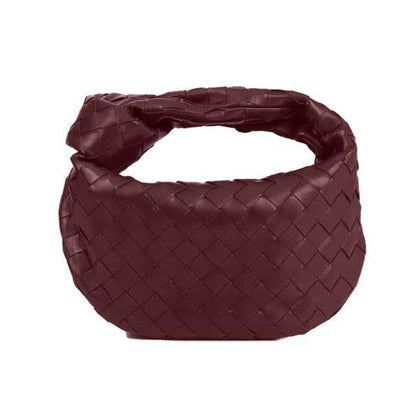 Minibolso elegante y compacto en material de alta calidad.
