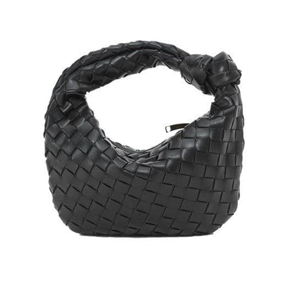 Minibolso elegante y compacto en material de alta calidad.