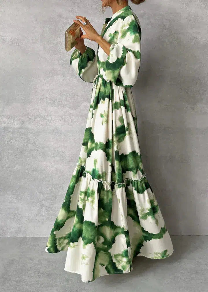 Elegante vestido largo con mangas largas y escote en V: fluido y chic.