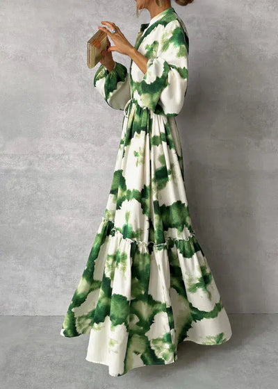 Elegante vestido largo con mangas largas y escote en V: fluido y chic.