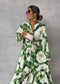 Elegante vestido largo con mangas largas y escote en V: fluido y chic.