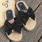KERIN | Sandalias de esparto con lazo oversize y detalle de perla