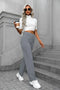 Pantalon féminin à haute teneur en taille avec boutonnage et élastique